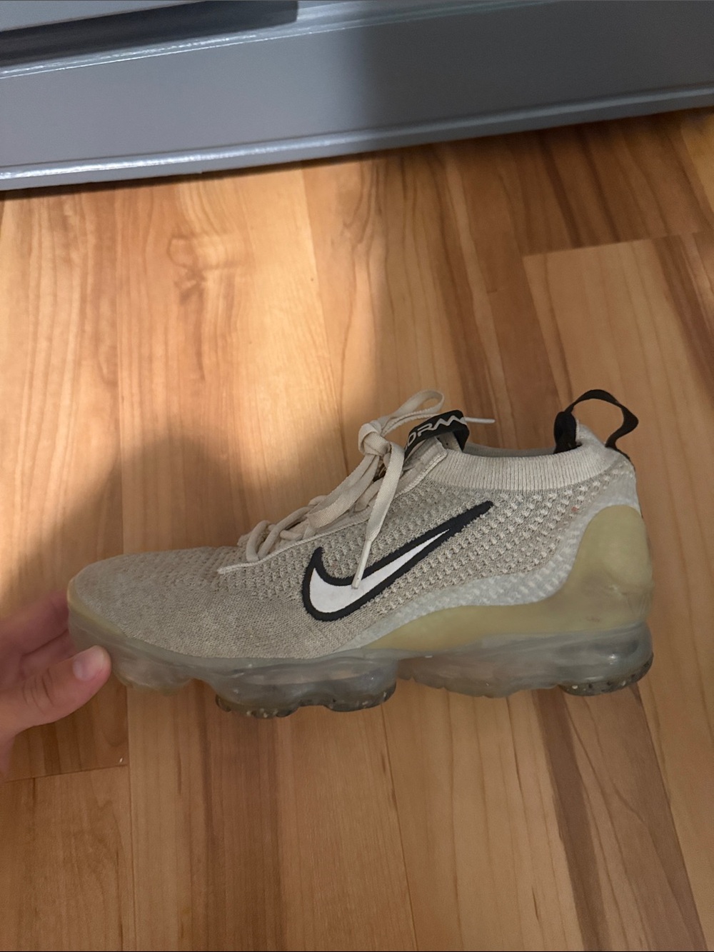 Nike Beige Flyknit VaporMax Sneaker with Black Swoosh